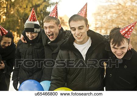 Group of young friends with wearing party hats View Large Photo Image Stock Image - Group of young friends with wearing party hats. Fotosearch