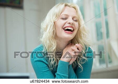 Happy young woman with eyes closed and hands together View Large Photo Image Picture - Happy young woman with eyes closed and hands together. Fotosearch