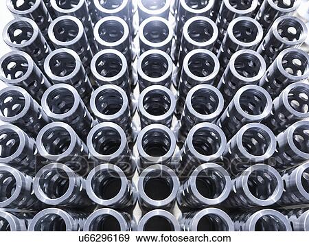 Stock Photo - Large group of engineered parts in factory, full frame. Fotosearch