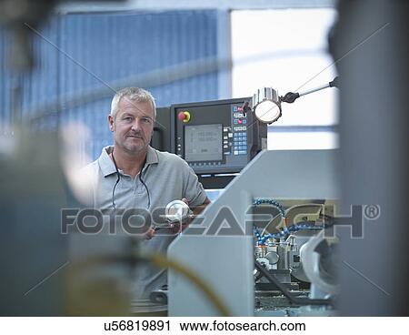 Lathe operator working in factory, portrait View Large Photo Image Stock Image - Lathe operator working in factory, portrait. Fotosearch