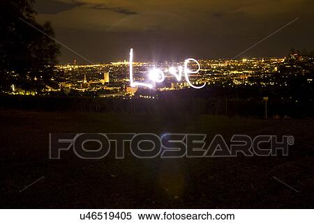 Love, light painting at night with view of Vienna, Austria View Large Photo Image Stock Photography - Love, light painting at night with view of Vienna, Austria. Fotosearch