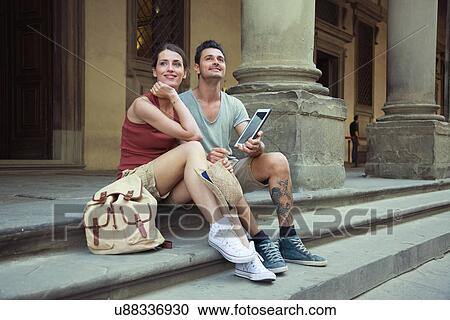 Man and woman sitting on steps of Uffizi Gallery, Florence, Tuscany, Italy View Large Photo Image Stock Image - Man and woman sitting on steps of Uffizi Gallery, Florence, Tuscany, Italy. Fotosearch