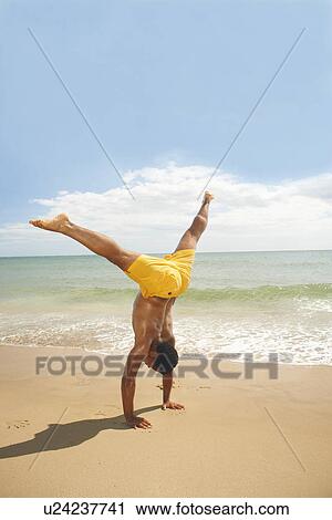 Man doing cartwheels View Large Photo Image Stock Image - Man doing cartwheels. Fotosearch