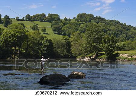 Man fishing in River Wye, Herefordshire, England, UK View Large Photo Image Stock Image - Man fishing in River Wye, Herefordshire, England, UK. Fotosearch