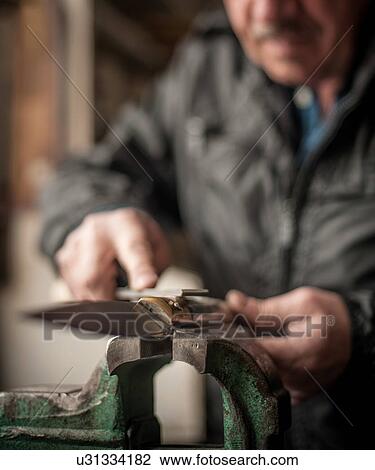 Man making knife, Barumini, Sardinia, Italy View Large Photo Image Stock Image - Man making knife, Barumini, Sardinia, Italy. Fotosearch