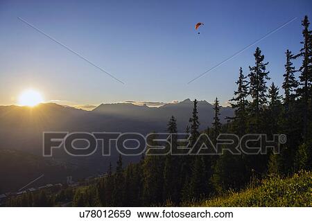 Man paragliding, Les Arcs, Switzerland View Large Photo Image Stock Photo - Man paragliding, Les Arcs, Switzerland. Fotosearch