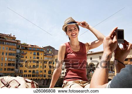 Man photographing woman on Ponte Vecchio, Florence, Tuscany, Italy View Large Photo Image Stock Photo - Man photographing woman on Ponte Vecchio, Florence, Tuscany, Italy. Fotosearch