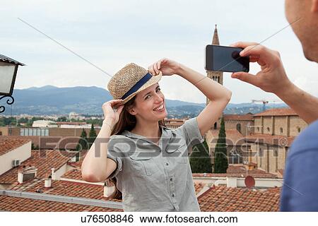 Man photographing woman with smartphone, Florence, Tuscany, Italy View Large Photo Image Stock Photograph - Man photographing woman with smartphone, Florence, Tuscany, Italy. Fotosearch