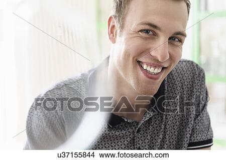 Picture - Man posing for camera. Fotosearch