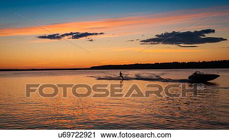 Man water skiing, Lulea, Lapland, Sweden View Large Photo Image Stock Image - Man water skiing, Lulea, Lapland, Sweden. Fotosearch