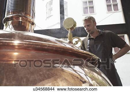 Picture - Man working at brewery. Fotosearch