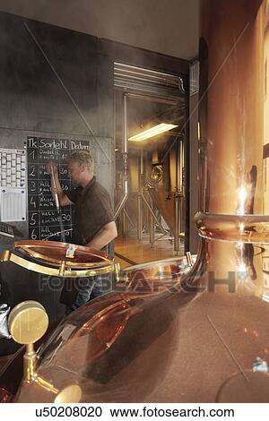 Man working at brewery View Large Photo Image Stock Image - Man working at brewery. Fotosearch