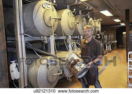 Man working at brewery View Large Photo Image Stock Image - Man working at brewery. Fotosearch