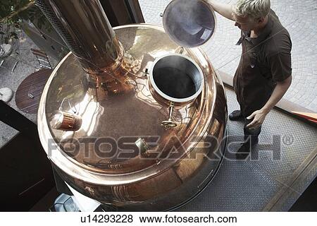 Man working at brewery View Large Photo Image Stock Photo - Man working at brewery. Fotosearch