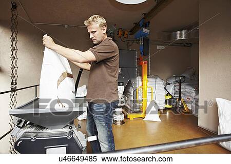 Stock Photography - Man working at brewery. Fotosearch