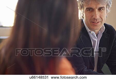Mature businessman in meeting View Large Photo Image Stock Image - Mature businessman in meeting. Fotosearch