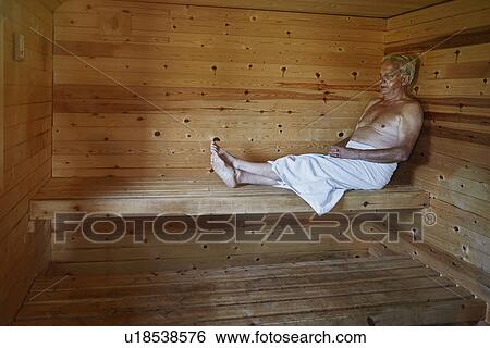 Mature man relaxing in sauna View Large Photo Image Stock Photograph - Mature man relaxing in sauna. Fotosearch