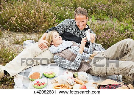Mid adult couple having picnic View Large Photo Image Stock Image - Mid adult couple having picnic. Fotosearch