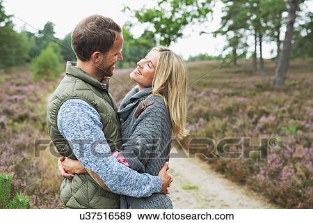 Mid adult couple hugging View Large Photo Image Stock Photo - Mid adult couple hugging. Fotosearch