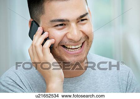 Mid adult man on telephone call View Large Photo Image Picture - Mid adult man on telephone call. Fotosearch