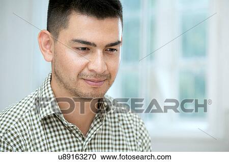 Mid adult man thinking View Large Photo Image Stock Image - Mid adult man thinking. Fotosearch