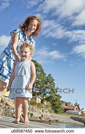 Mother and daughter at coast, Utvalnas, Gavle, Sweden View Large Photo Image Stock Image - Mother and daughter at coast, Utvalnas, Gavle, Sweden. Fotosearch