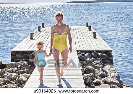Stock Photography - Mother and daughter hand in hand, Utvalnas, Gavle, Sweden. Fotosearch