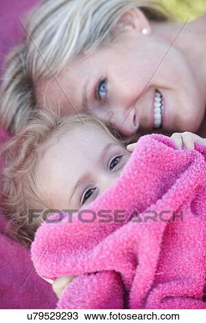 Mother and daughter in pink towel View Large Photo Image Stock Image - Mother and daughter in pink towel. Fotosearch