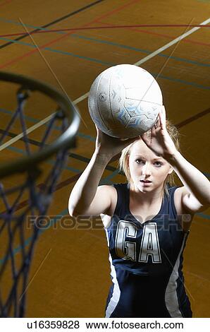 Netball player aiming at goal View Large Photo Image Stock Photo - Netball player aiming at goal. Fotosearch