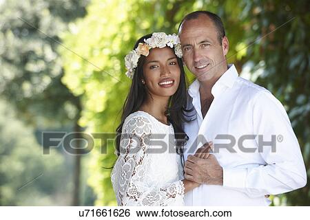 Stock Photograph - Newlyweds in embrace. Fotosearch