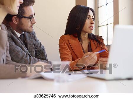 Office colleagues in meeting View Large Photo Image Stock Photograph - Office colleagues in meeting. Fotosearch