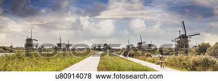 People walking along footpath, Kinderdijk, Olanda, Amsterdam View Large Photo Image Stock Photo - People walking along footpath, Kinderdijk, Olanda, Amsterdam. Fotosearch