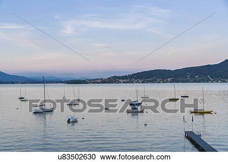 Stock Image - Pier and boats, Meina, Italy. Fotosearch