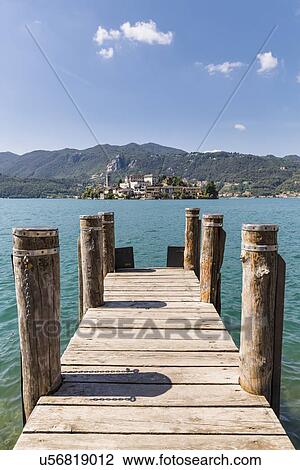 Pier and San Giulio Island, Italy View Large Photo Image Stock Image - Pier and San Giulio Island, Italy. Fotosearch