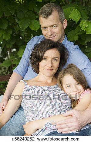 Portrait of a family with daughter View Large Photo Image Stock Image - Portrait of a family with daughter. Fotosearch