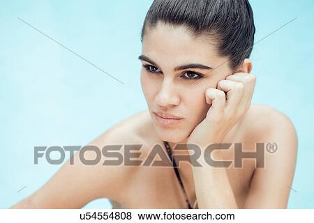Portrait of beautiful young woman poolside View Large Photo Image Stock Photo - Portrait of beautiful young woman poolside. Fotosearch