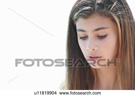 Portrait of brunette teenage girl looking down View Large Photo Image Picture - Portrait of brunette teenage girl looking down. Fotosearch