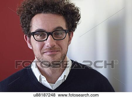 Stock Photo - Portrait of businessman wearing glasses. Fotosearch