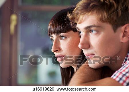 Portrait of couple looking away, close up View Large Photo Image Stock Image - Portrait of couple looking away, close up. Fotosearch