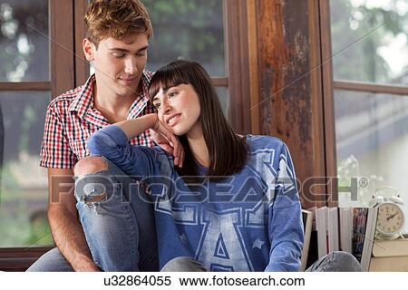 Portrait of couple, woman leaning on man's knee View Large Photo Image Stock Photography - Portrait of couple, woman leaning on man's knee. Fotosearch