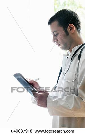 Portrait of doctor using digital tablet View Large Photo Image Stock Photo - Portrait of doctor using digital tablet. Fotosearch