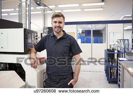 Stock Photo - Portrait of engineer and equipment in engineering factory. Fotosearch