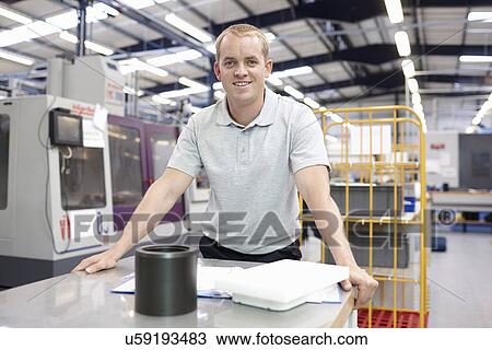Stock Image - Portrait of engineer in engineering factory. Fotosearch