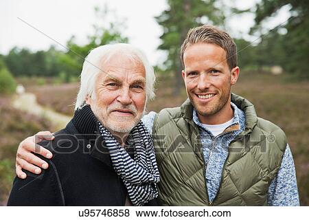 Portrait of father and adult son, smiling View Large Photo Image Stock Photo - Portrait of father and adult son, smiling. Fotosearch
