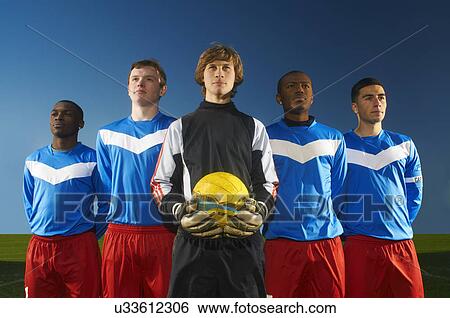 Portrait of football team, goalkeeper holding ball View Large Photo Image Stock Photograph - Portrait of football team, goalkeeper holding ball. Fotosearch