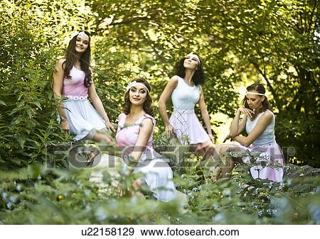 Portrait of four young ballet dancers in woods View Large Photo Image Stock Photo - Portrait of four young ballet dancers in woods. Fotosearch