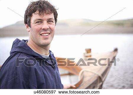 Portrait of man smiling towards camera, Wales, UK View Large Photo Image Stock Photo - Portrait of man smiling towards camera, Wales, UK. Fotosearch