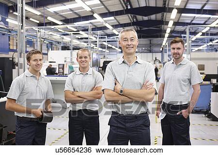 Portrait of manager and workers in engineering factory View Large Photo Image Stock Photograph - Portrait of manager and workers in engineering factory. Fotosearch