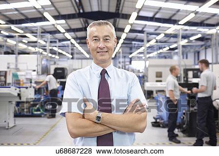 Stock Photo - Portrait of manager in engineering factory. Fotosearch