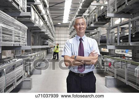 Portrait of manager in engineering warehouse View Large Photo Image Stock Photo - Portrait of manager in engineering warehouse. Fotosearch